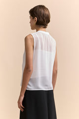 Sleeveless top with pleats