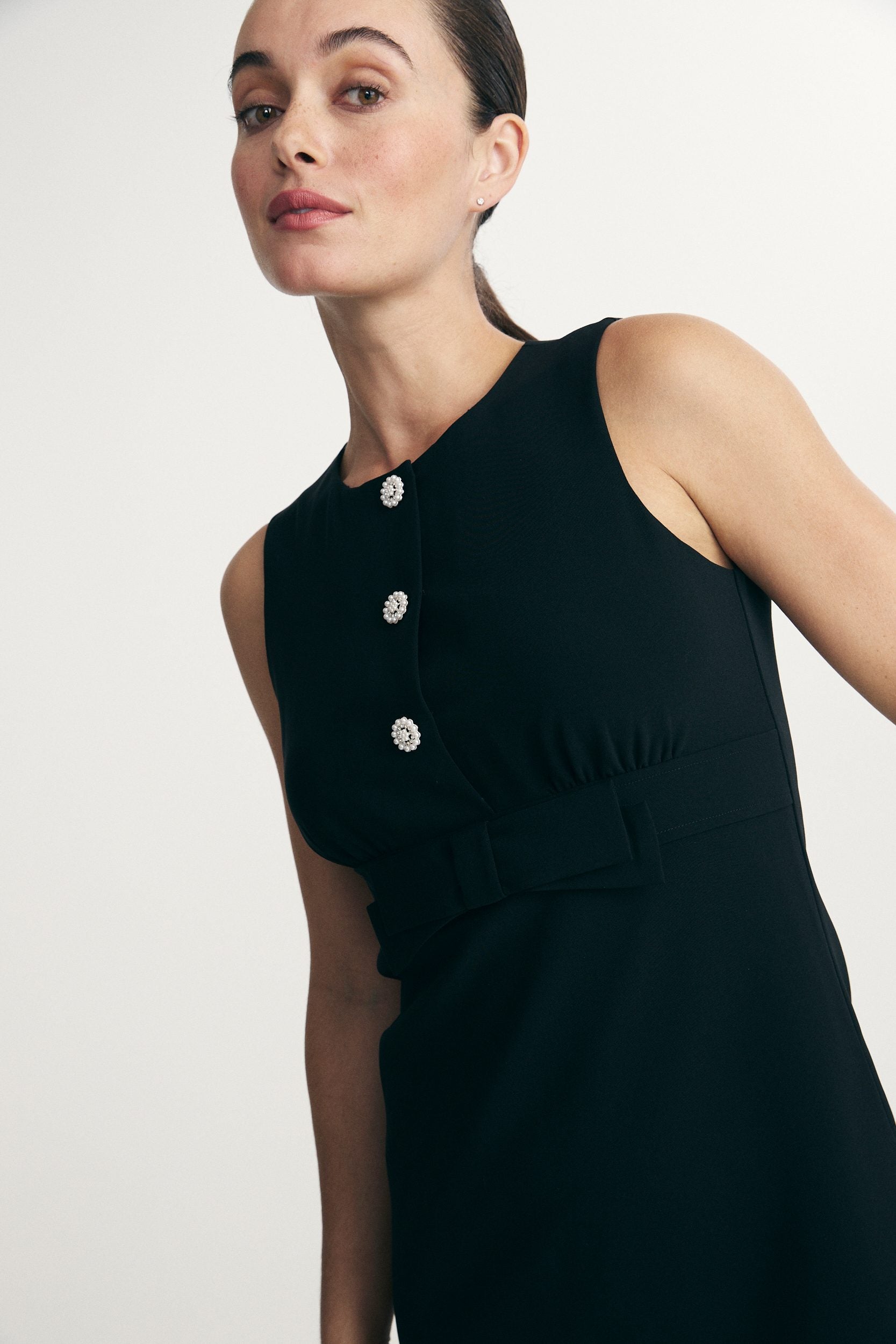 Dress with pearl buttons