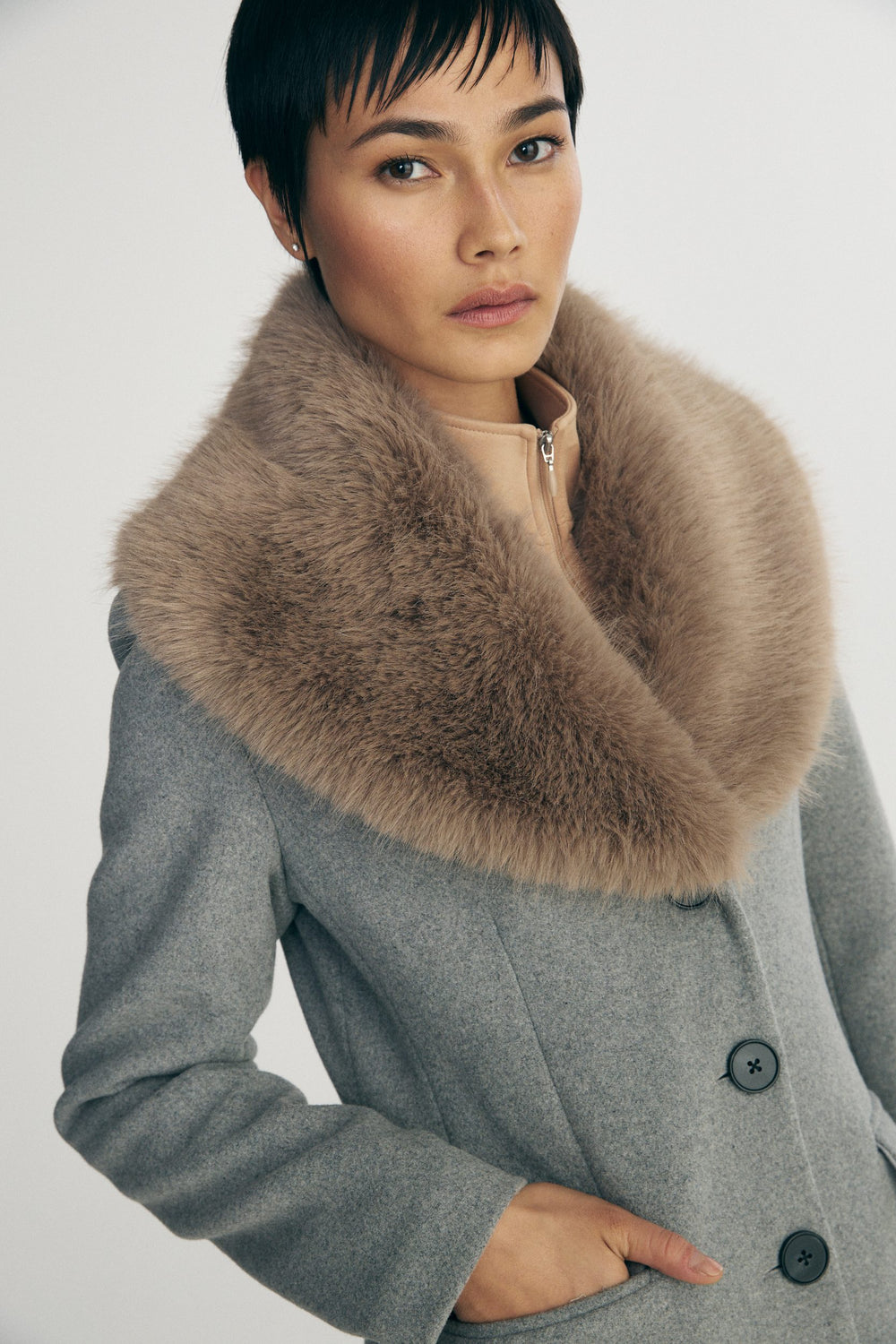Long coat with detachable faux fur collar