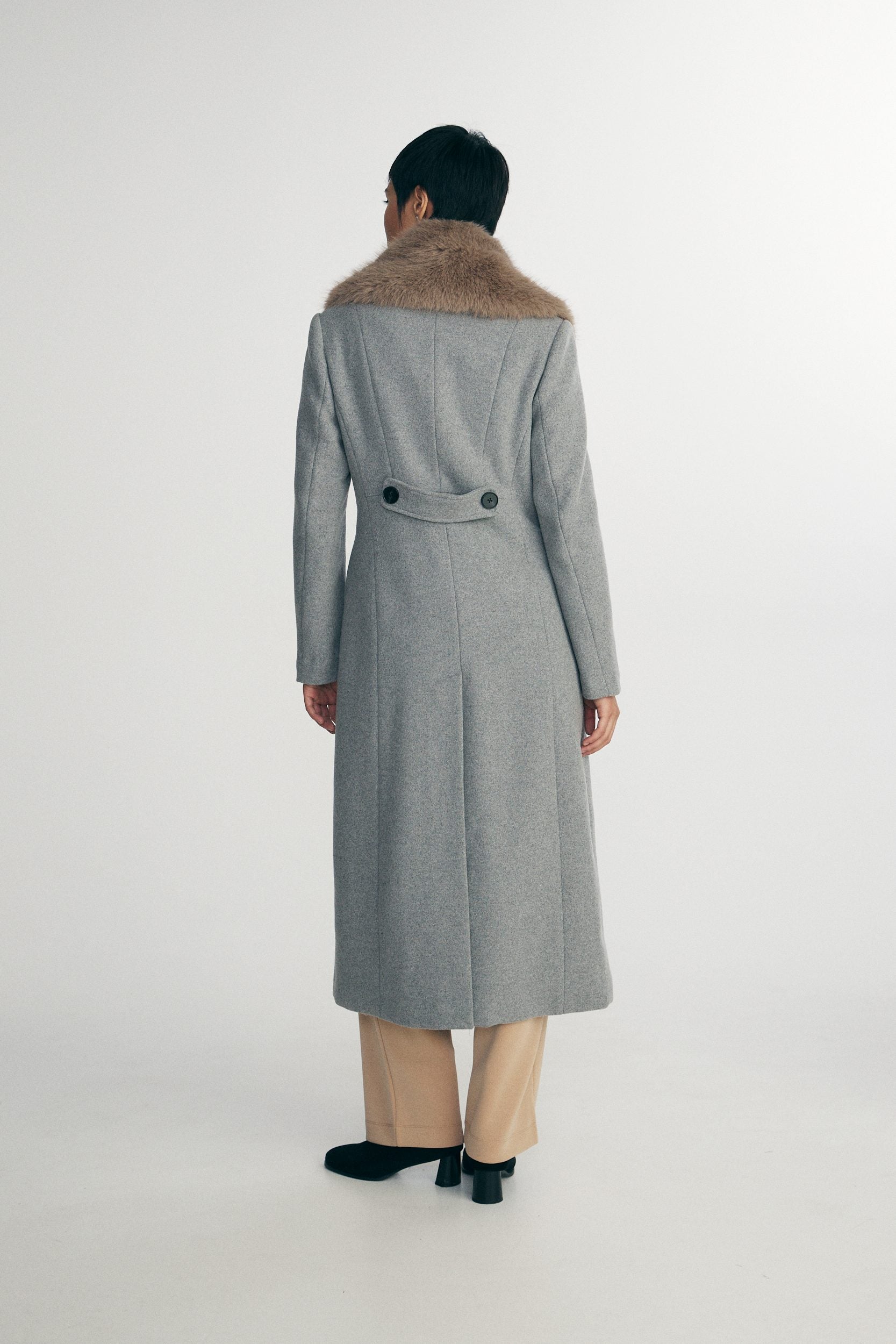 Long coat with detachable faux fur collar