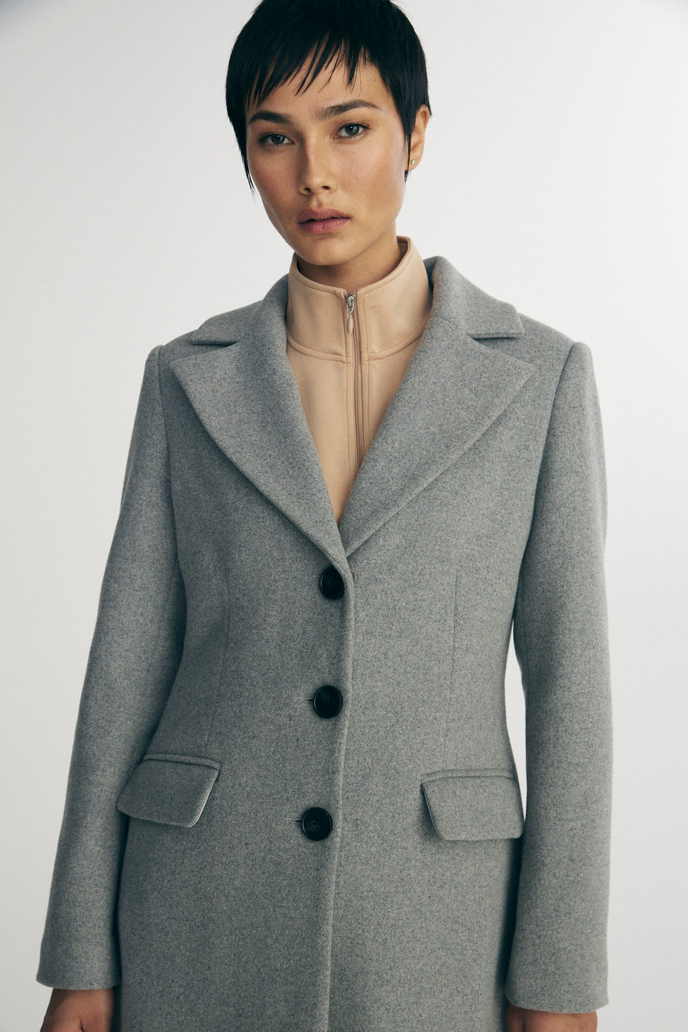Long coat with detachable faux fur collar