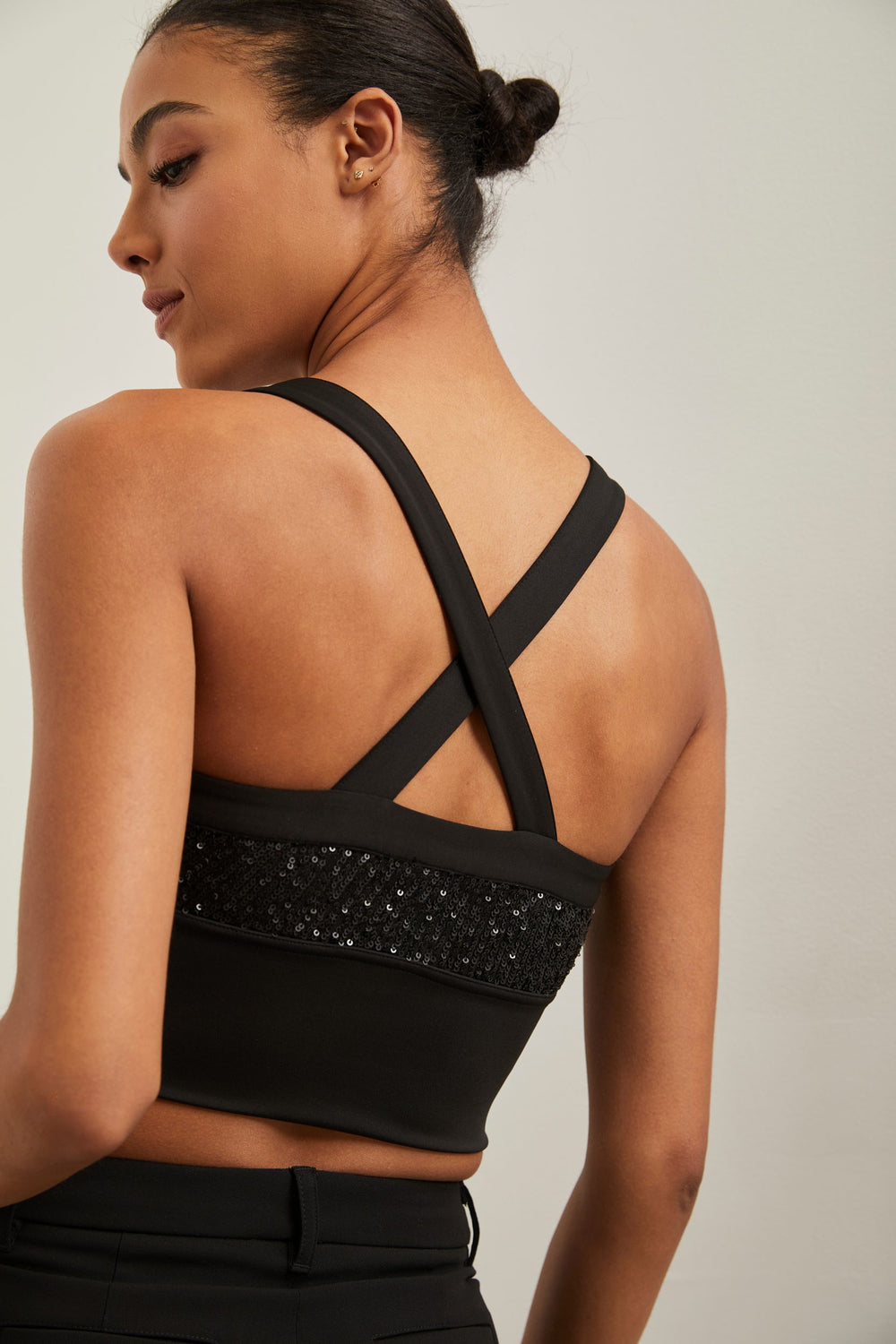 Cropped sequined top with crossed back straps