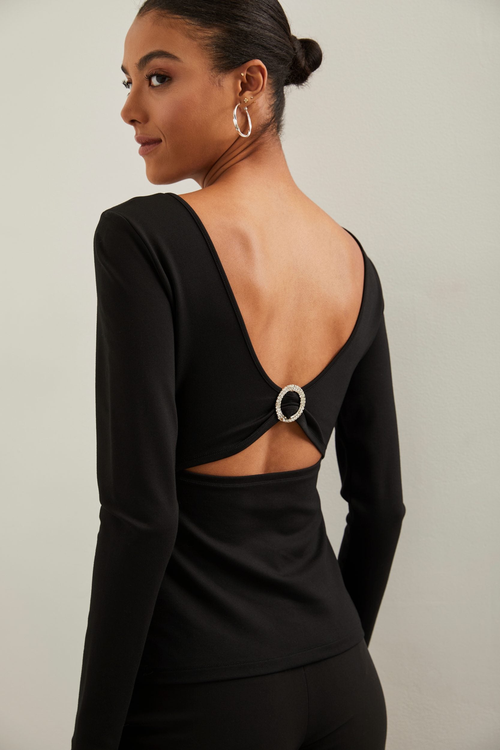 Open back top with embellished buckle